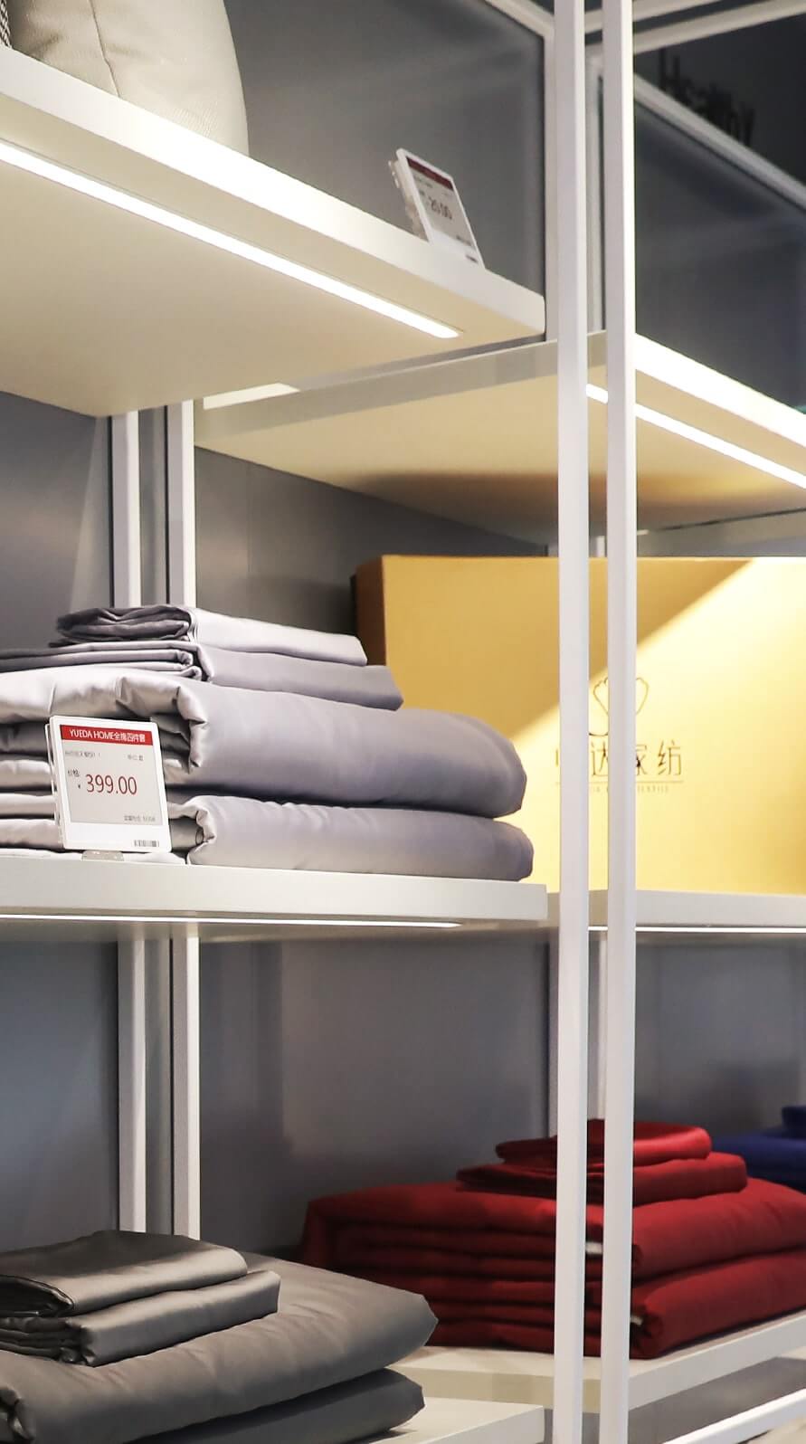 Electronic shelf labels displaying prices in a home textiles retail store