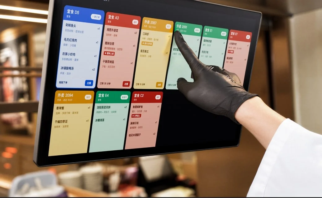 22-inch FLEX 3 KDS responding to a gloved touch in a restaurant kitchen